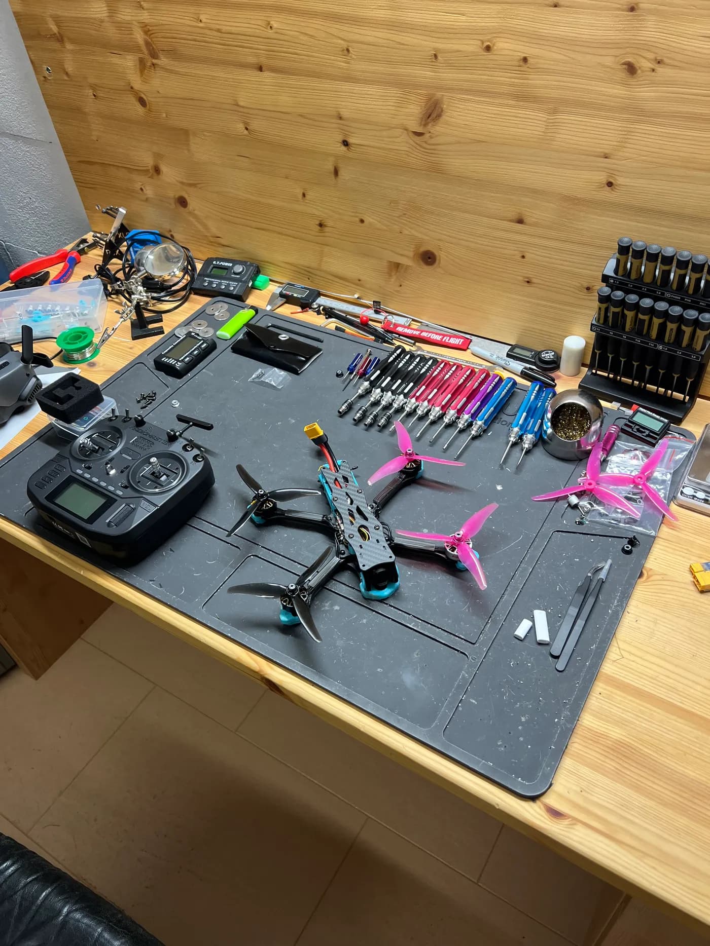 FPV quadcopter build on a mat with tools