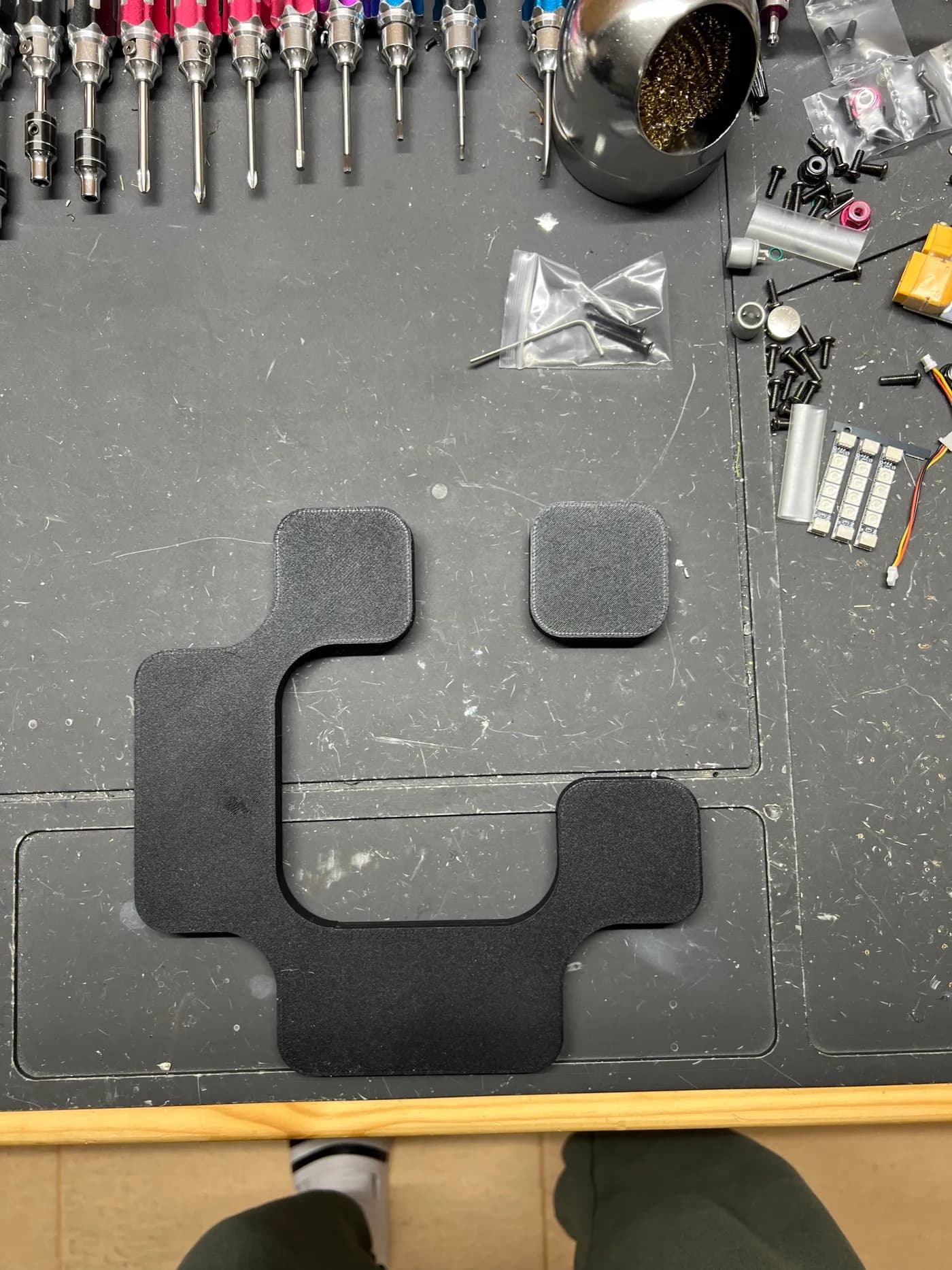 Finished 3D printed Ontora logo on a workbench